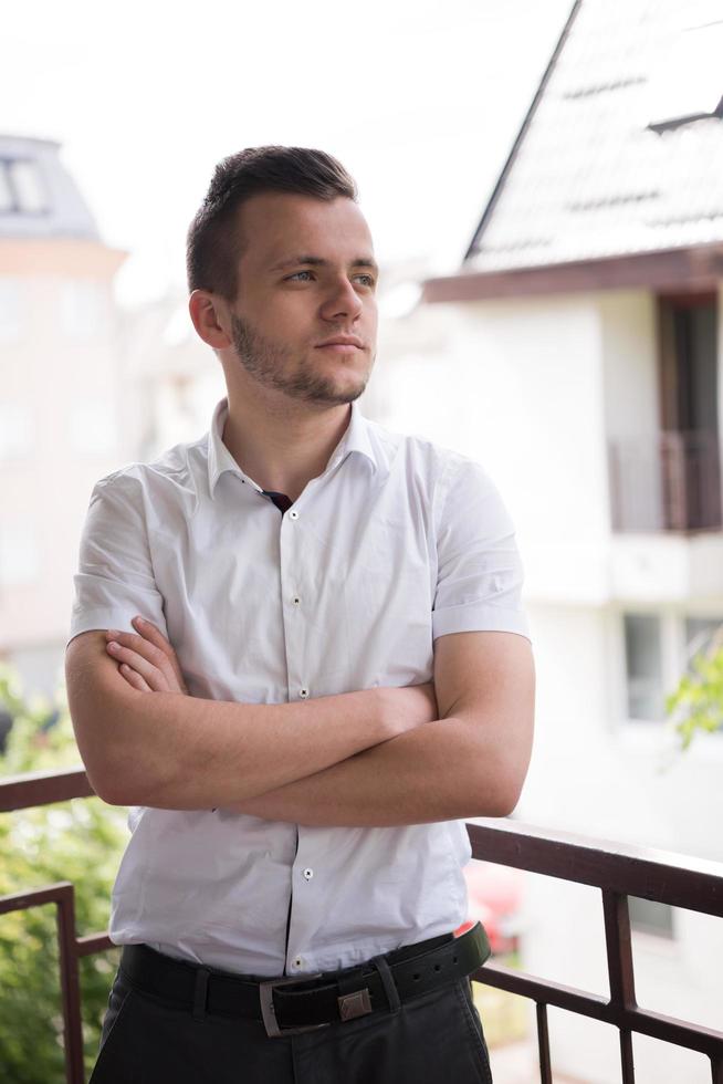 man standing at balcony photo