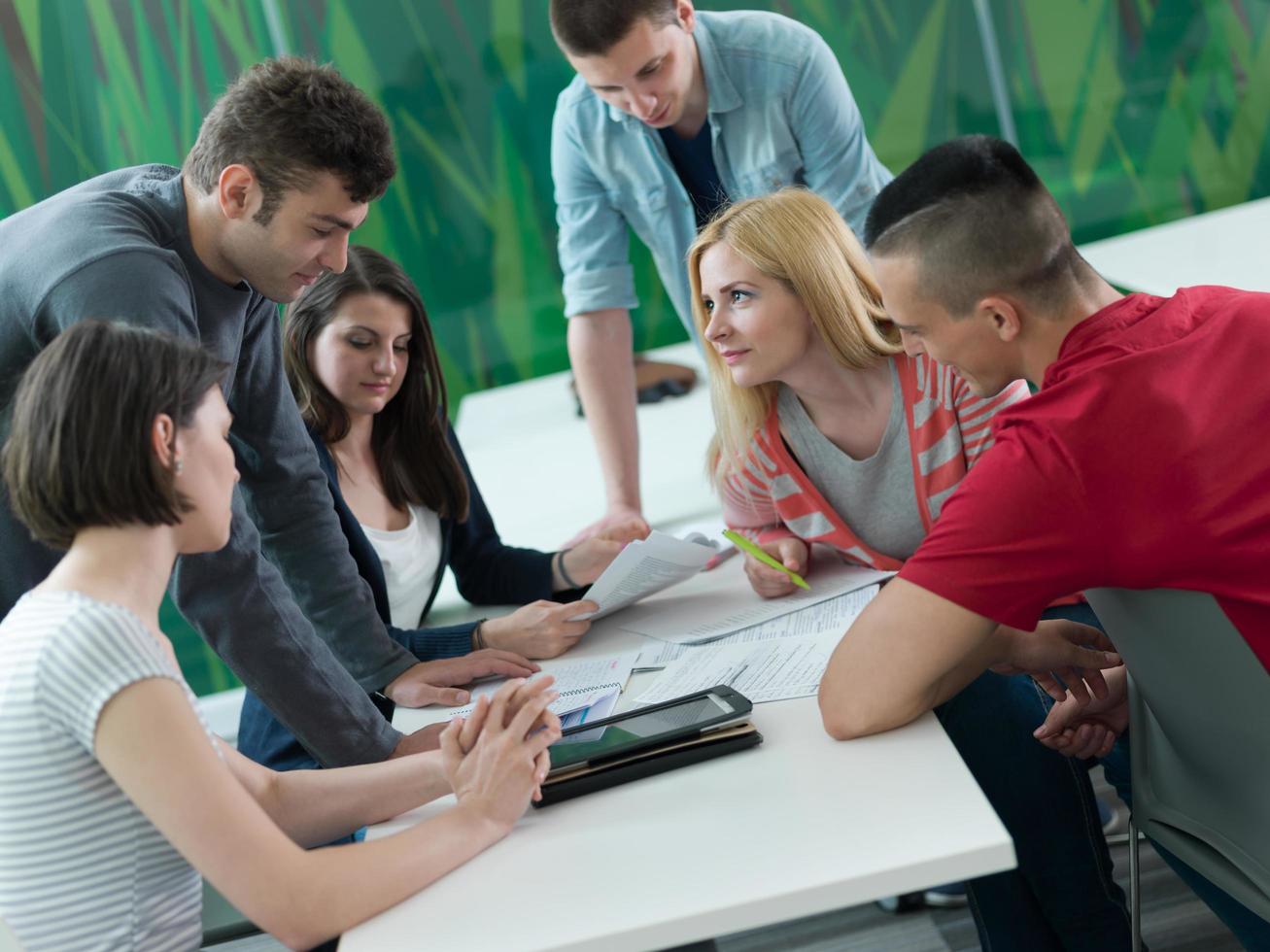 group of students study together in classroom photo