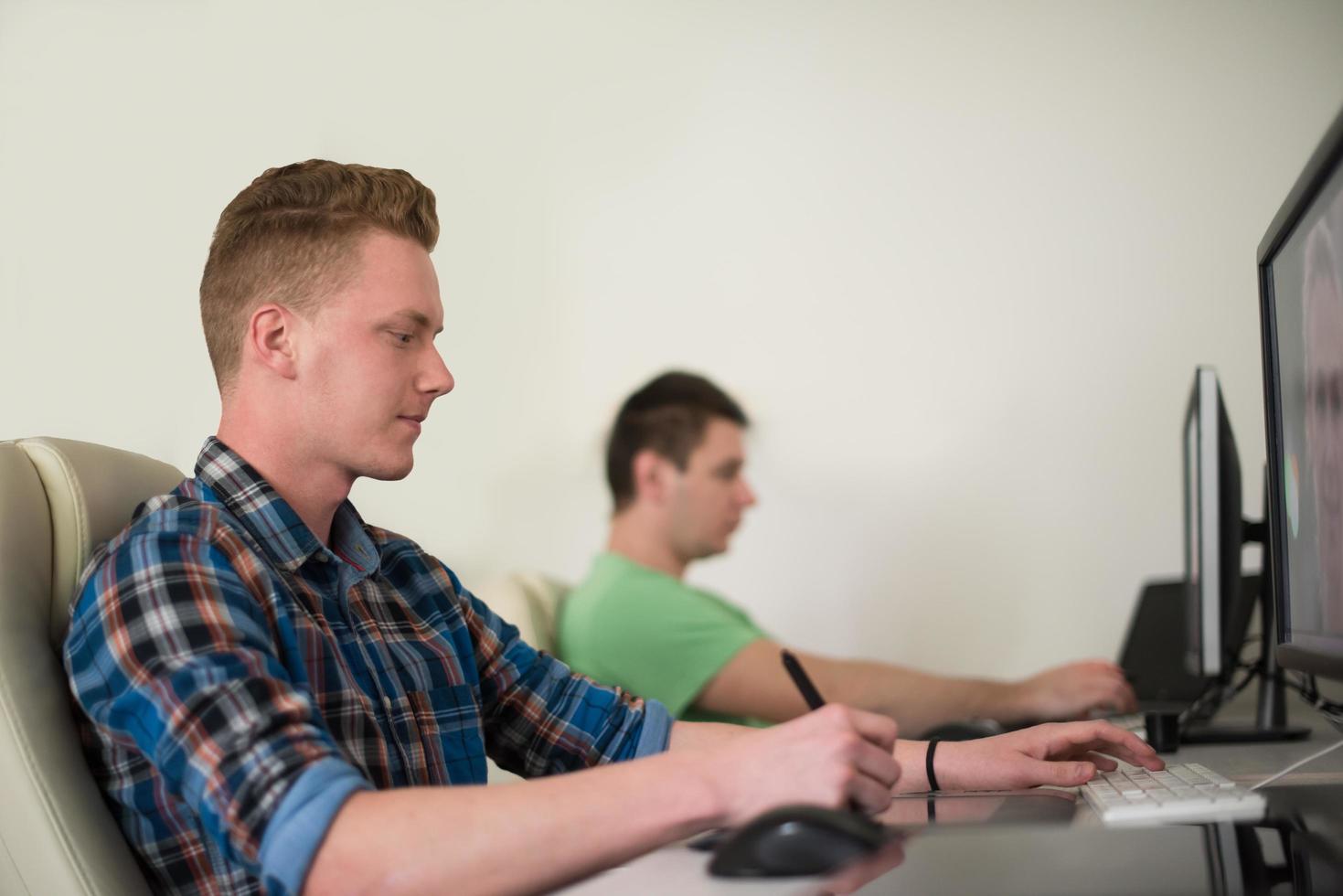 a group of graphic designers at work photo