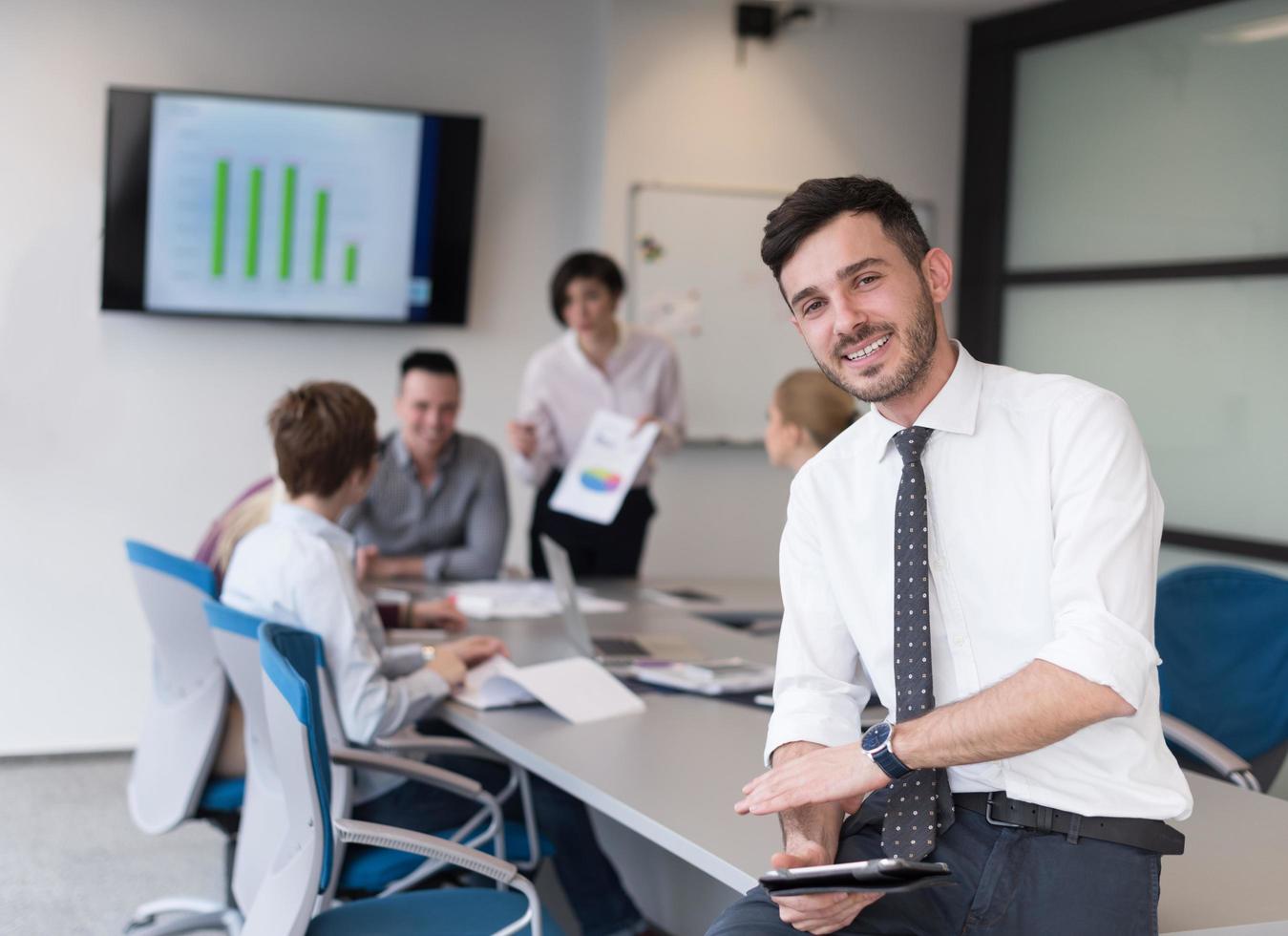 young business man with tablet at office meeting room photo