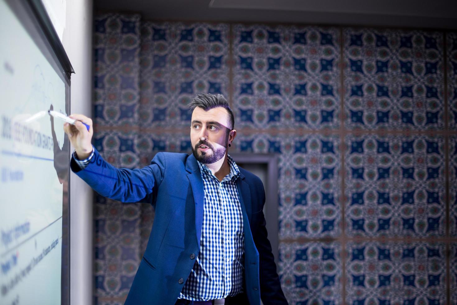 successful businessman giving presentations at conference room photo