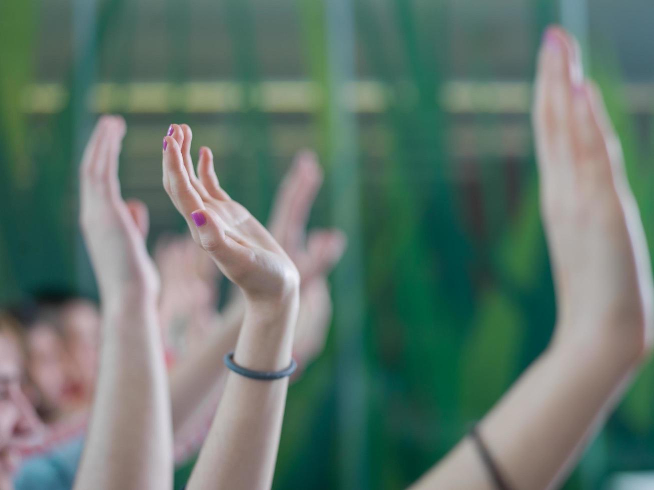 students group raise hands up on class photo