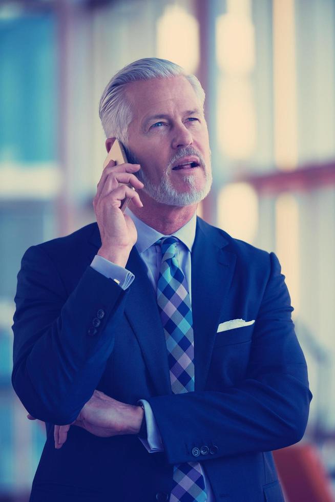 senior business man talk on mobile phone photo