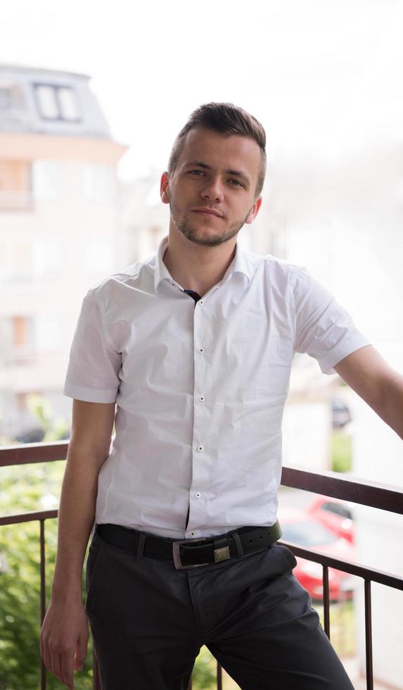 man standing at balcony photo