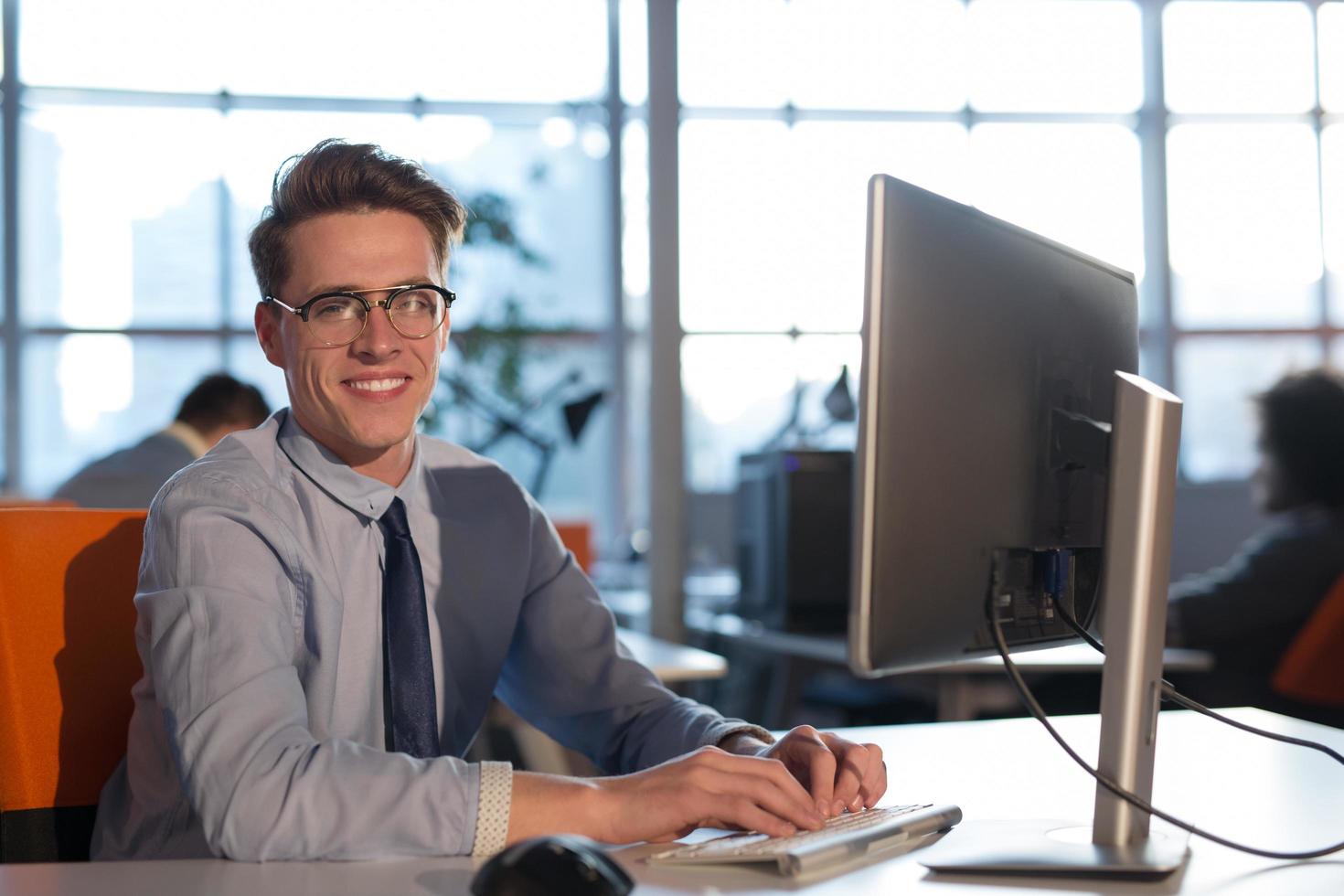 businessman working using a computer in startup office photo