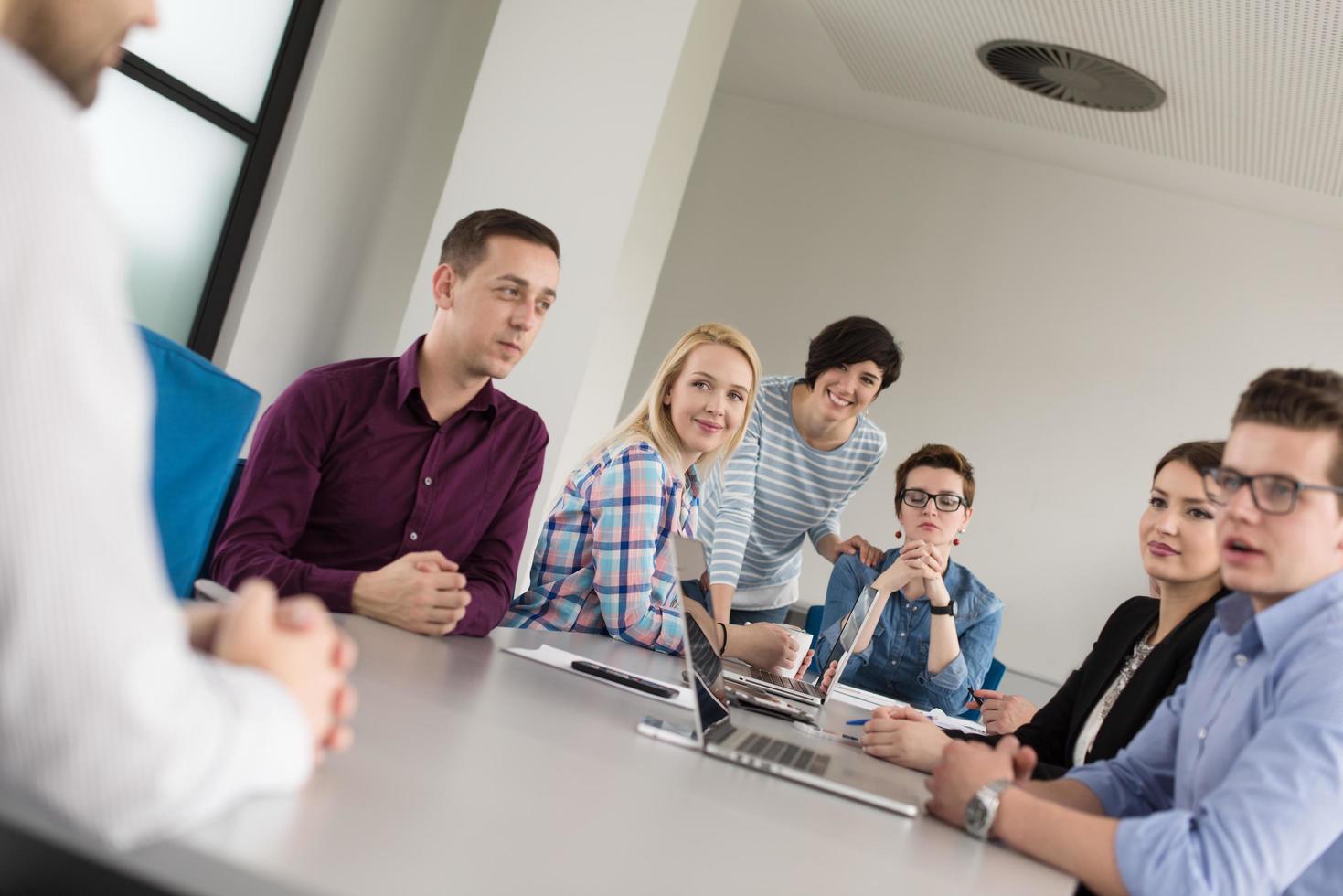 Business Team At A Meeting at modern office building photo