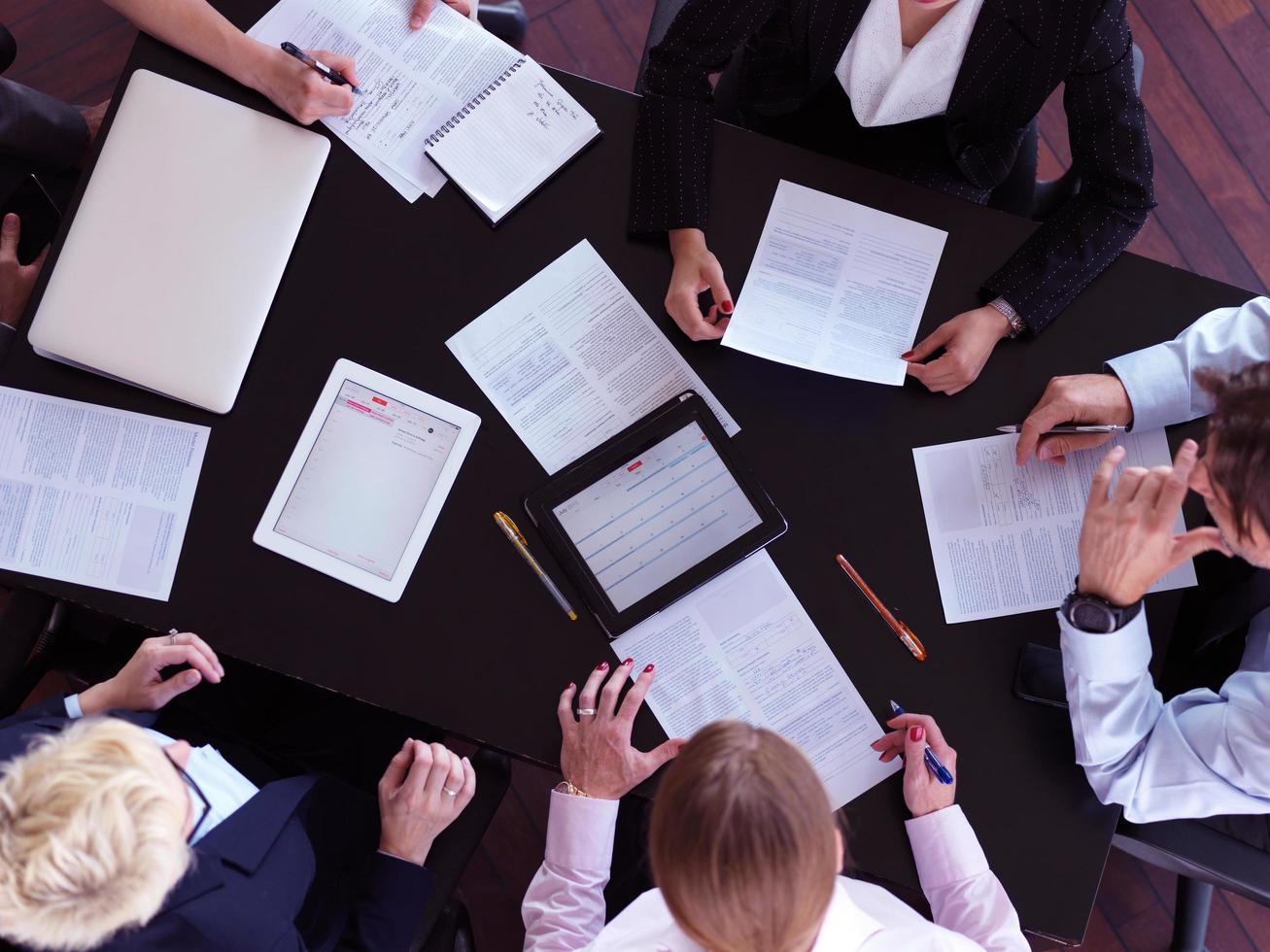 top view of business people group on meeting photo