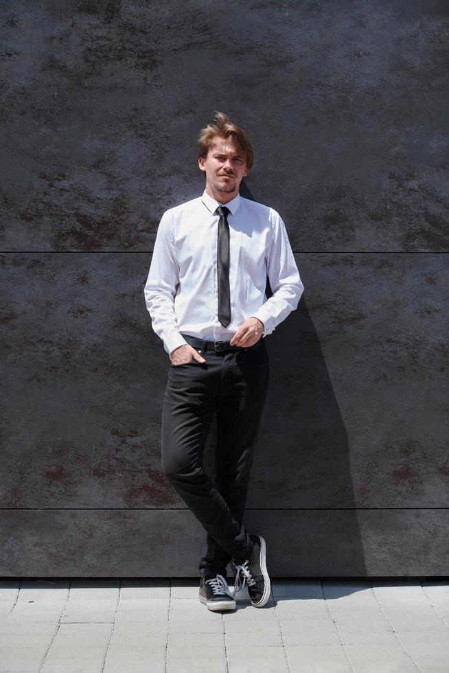 portrait of startup businessman in a white shirt with a tie photo