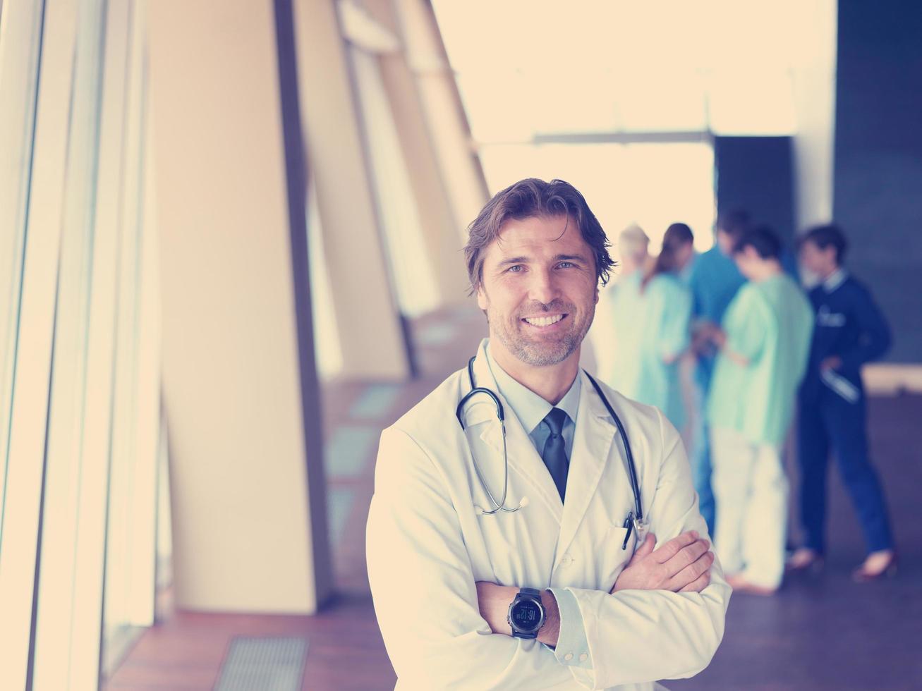 group of medical staff at hospital, doctor in front of team photo