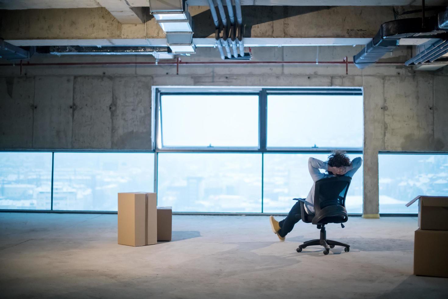 young business man taking a break on construction site photo