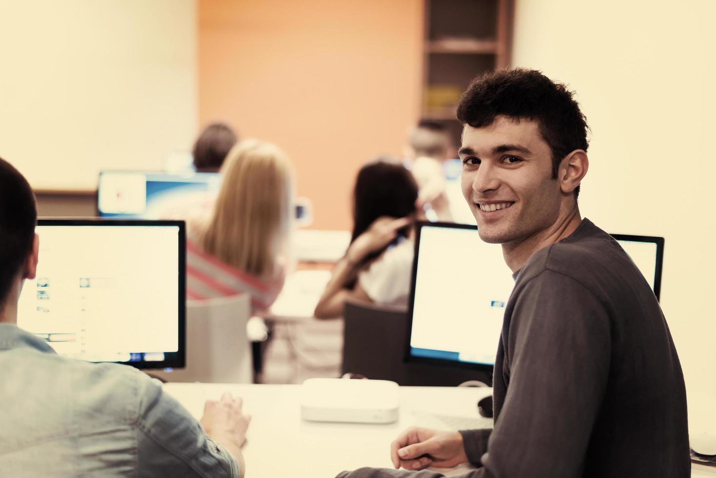 technology students group working  in computer lab school  classroom photo