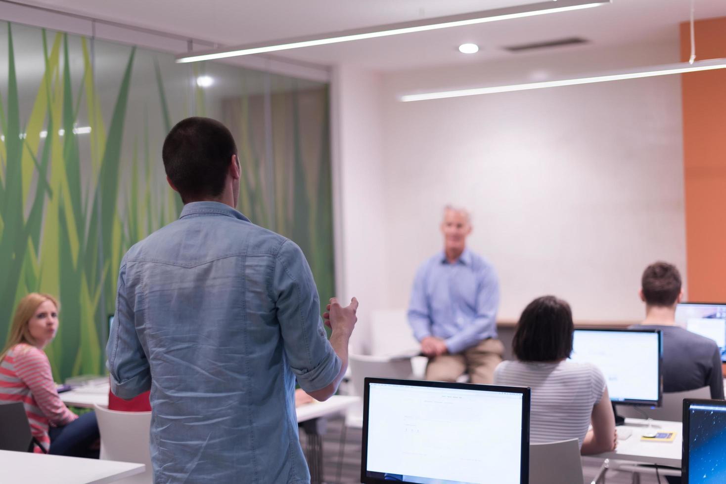 student answering a question in classroom photo