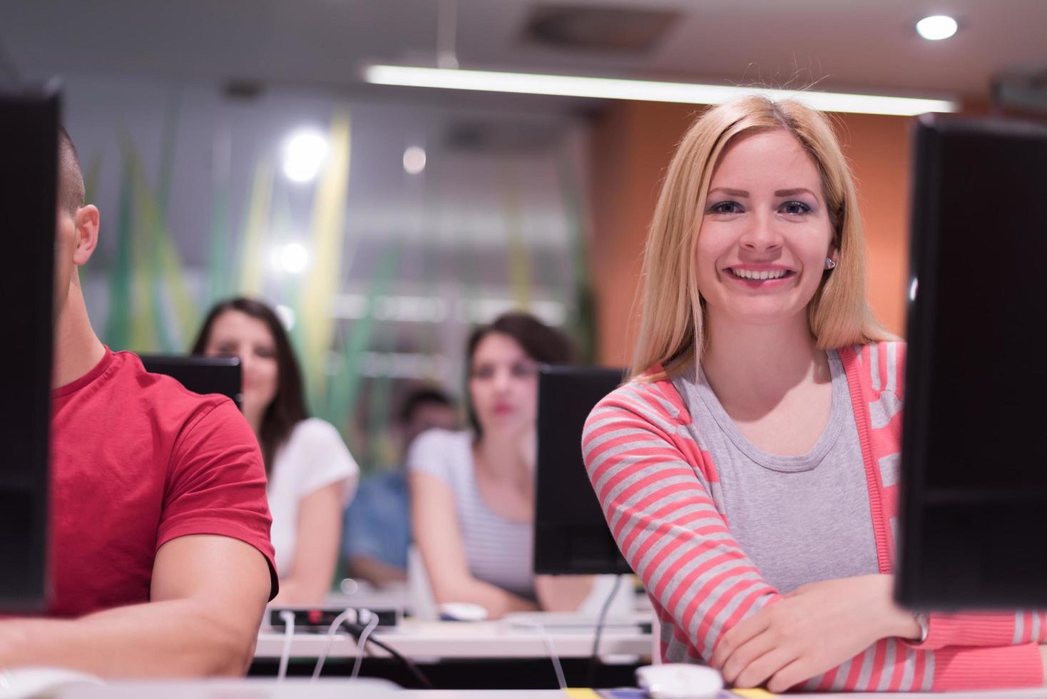 technology students group working  in computer lab school  classroom photo