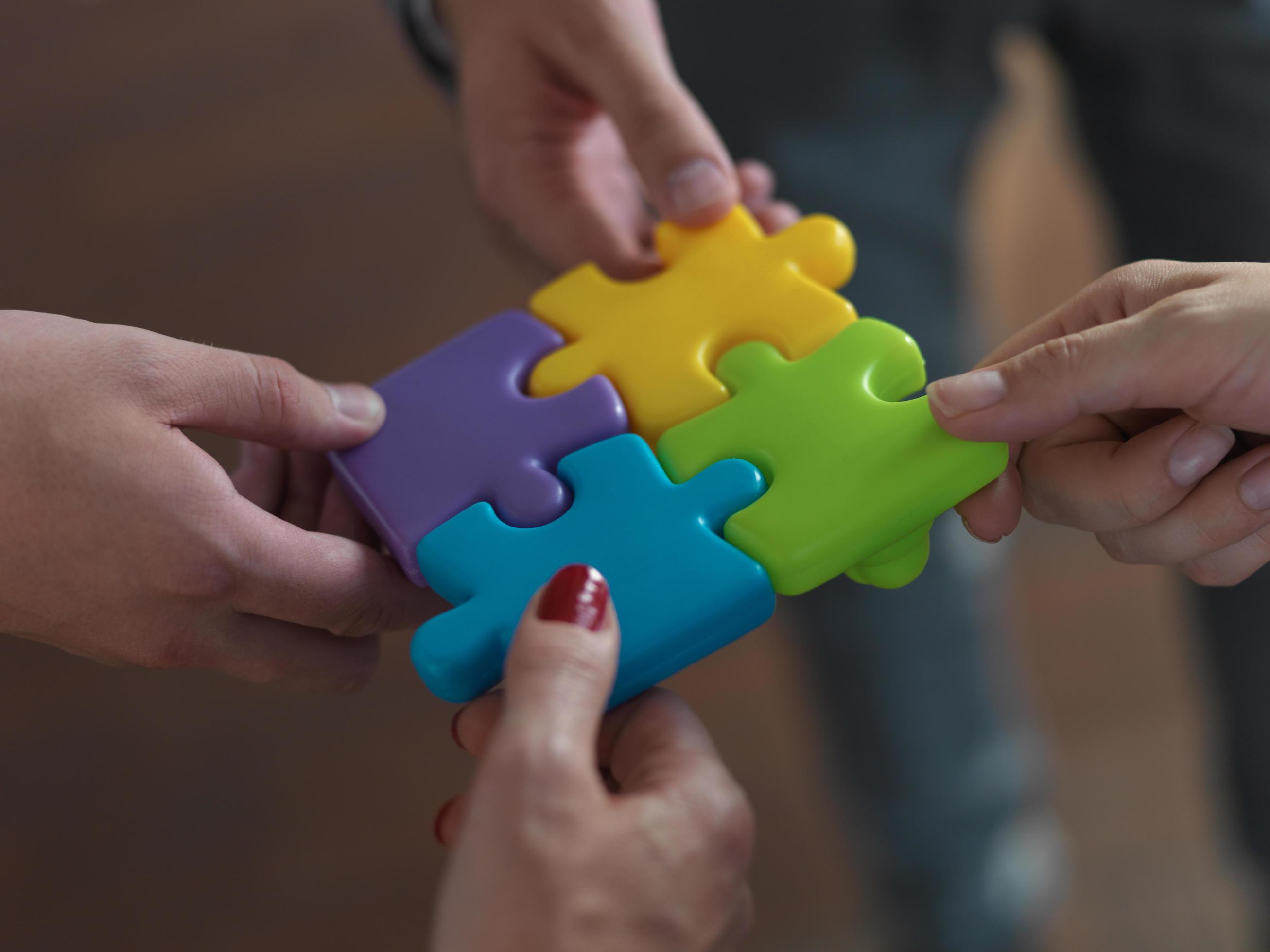 business people group assembling jigsaw puzzle 12449868 Stock Photo at