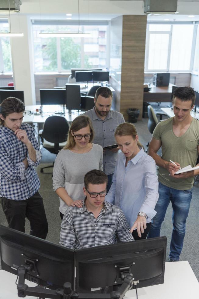 startup business people group working as team to find solution photo