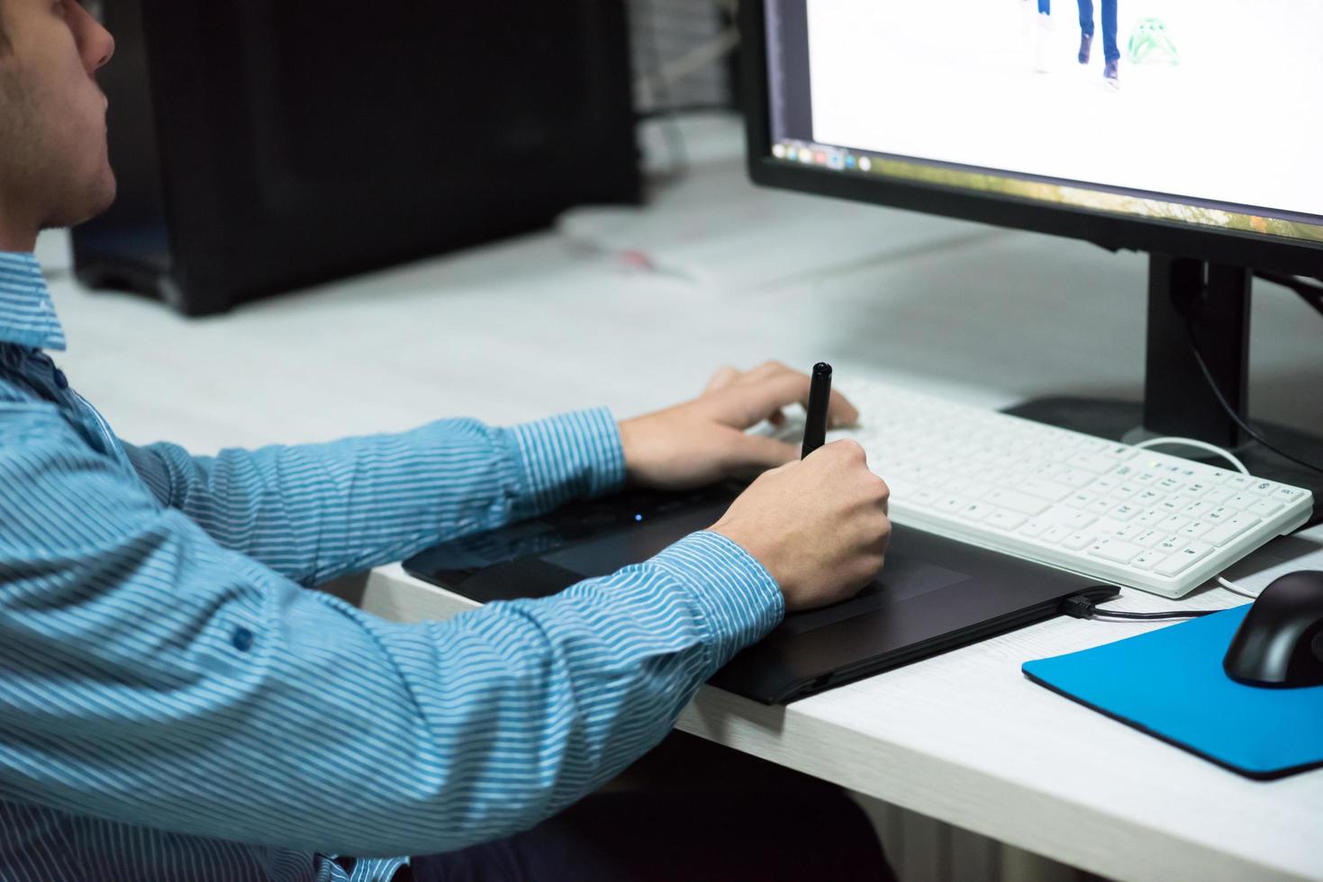 photo editor at his desk