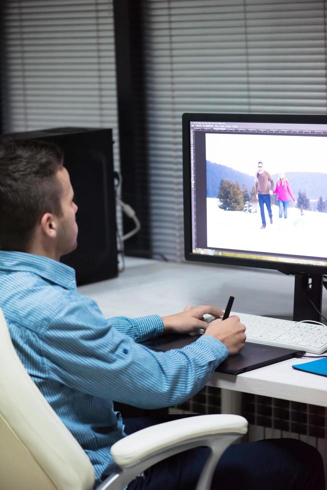 photo editor at his desk