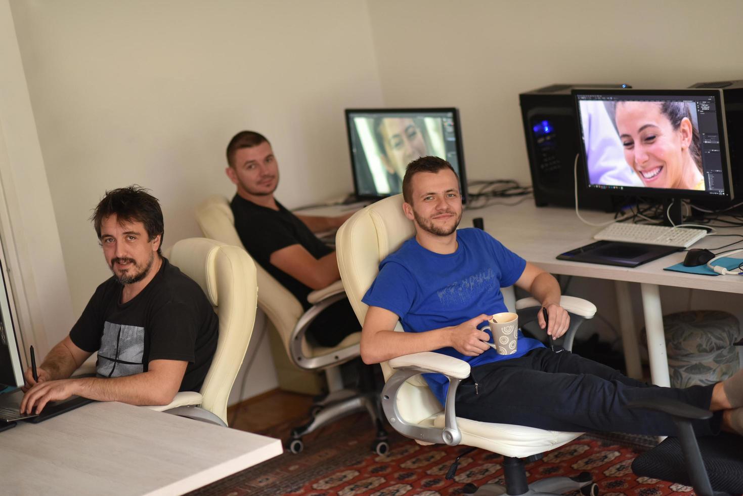 a group of graphic designers at work photo