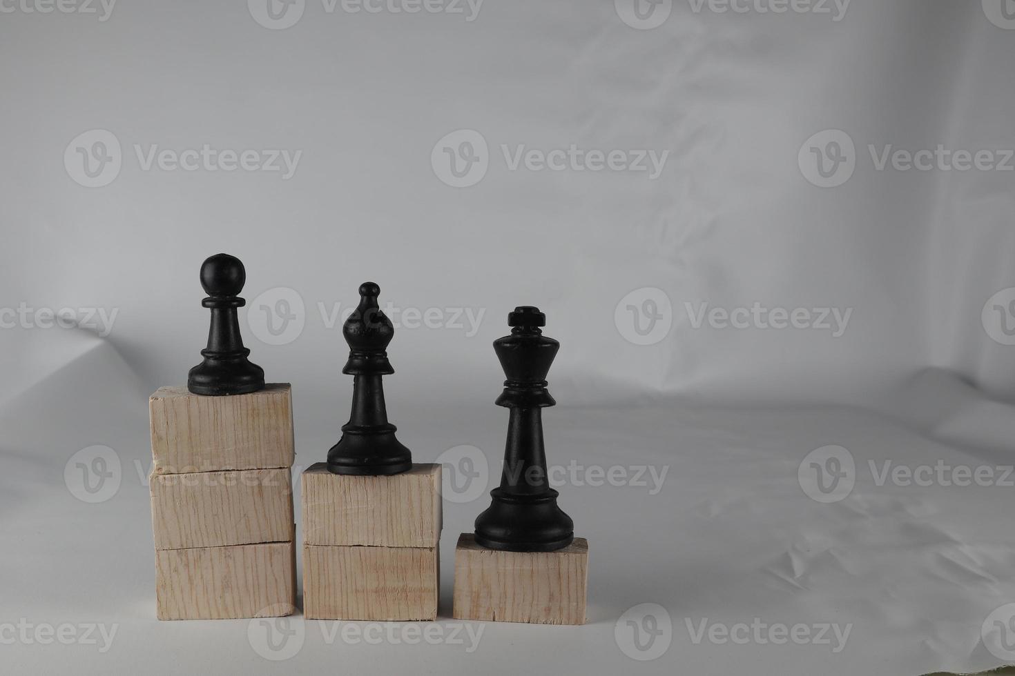 Chess pieces' from wooden cubes show the concepts of equity. Business concept photo