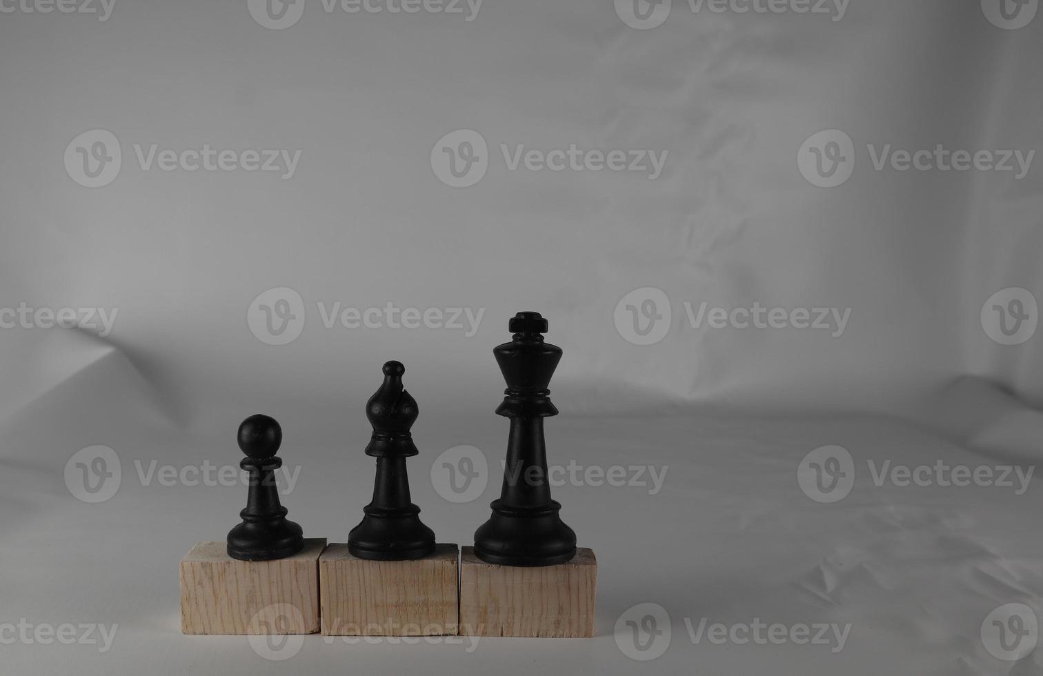 Chess pieces' from wooden cubes show the concepts of equality. Business concept photo