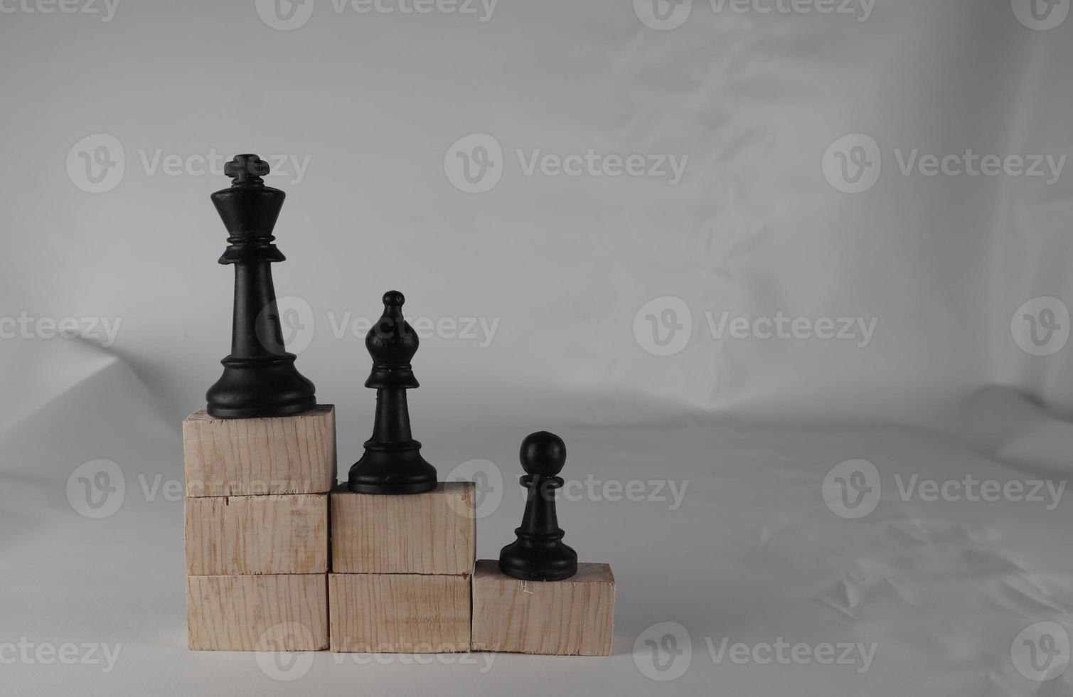 Chess pieces' from wooden cubes show the concepts of reality. Business concept photo