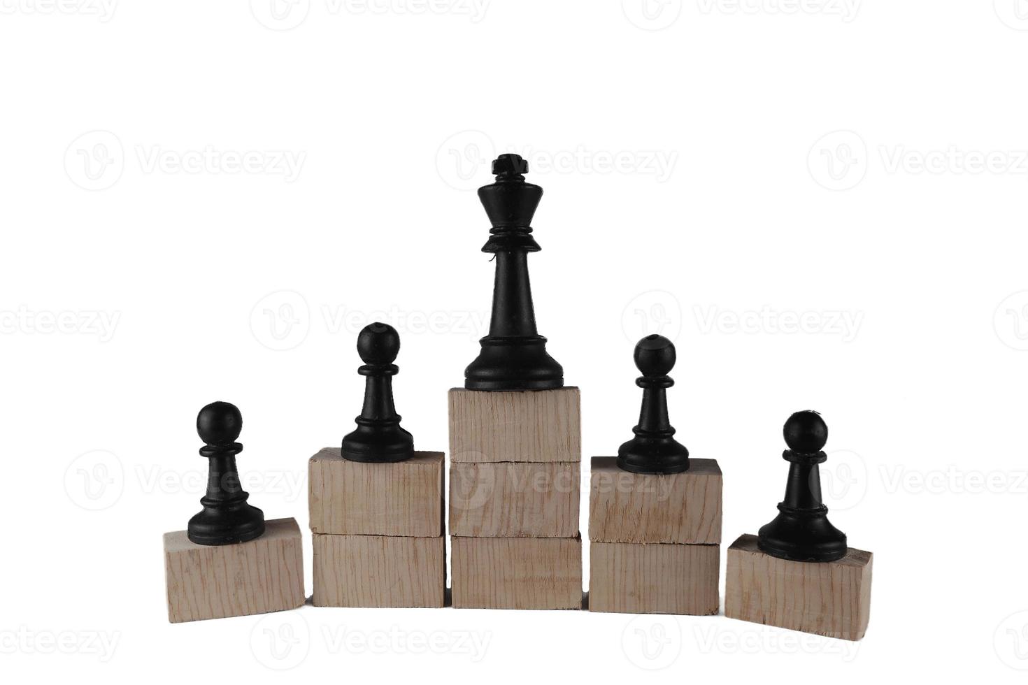 Chess pawn on the bottom and a chess queen on top, a concept to symbolize achievement, growth, and success. Business concept photo