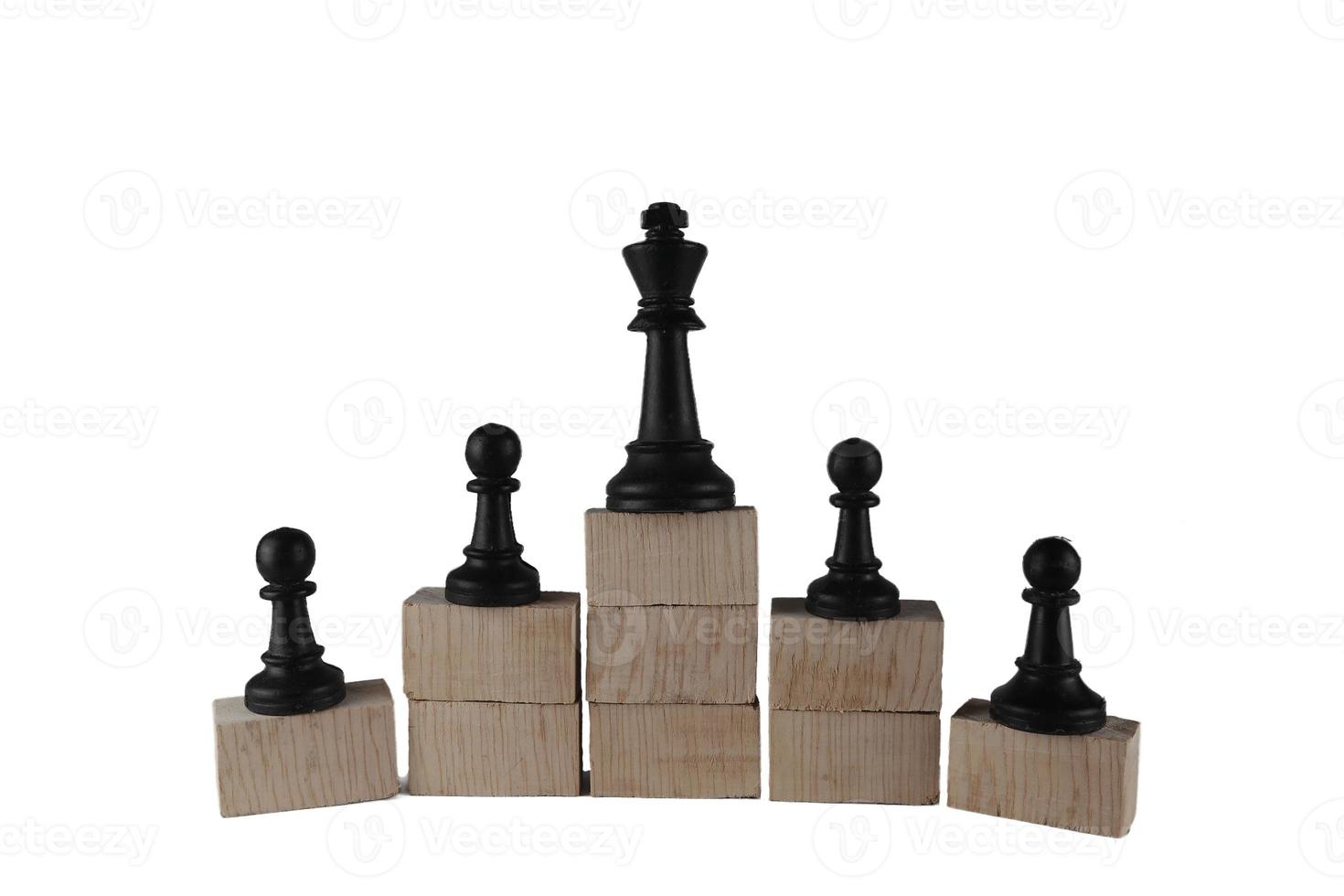 Chess pawn on the bottom and a chess queen on top, a concept to symbolize achievement, growth, and success. Business concept photo