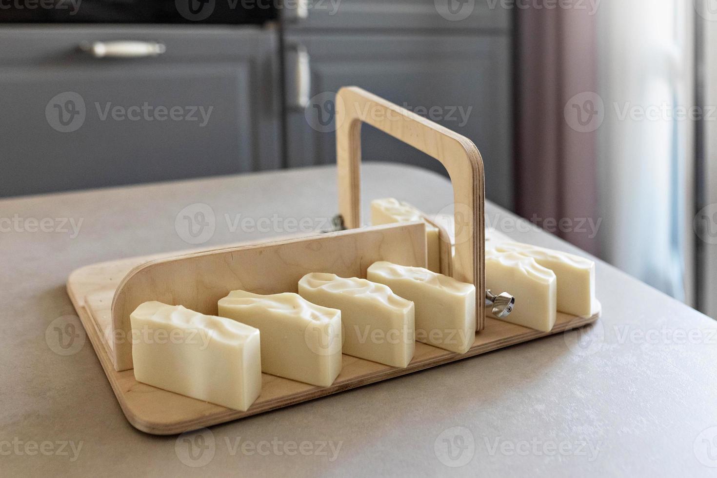 Handmade natural baby soap.Ready-made soap, cut into pieces on a special machine. Home spa. Small business photo