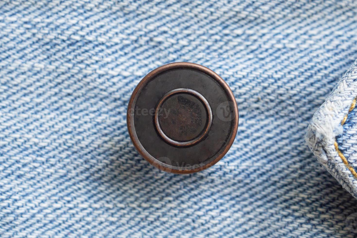 Metal button on blue denim jeans background 12467420 Stock Photo at