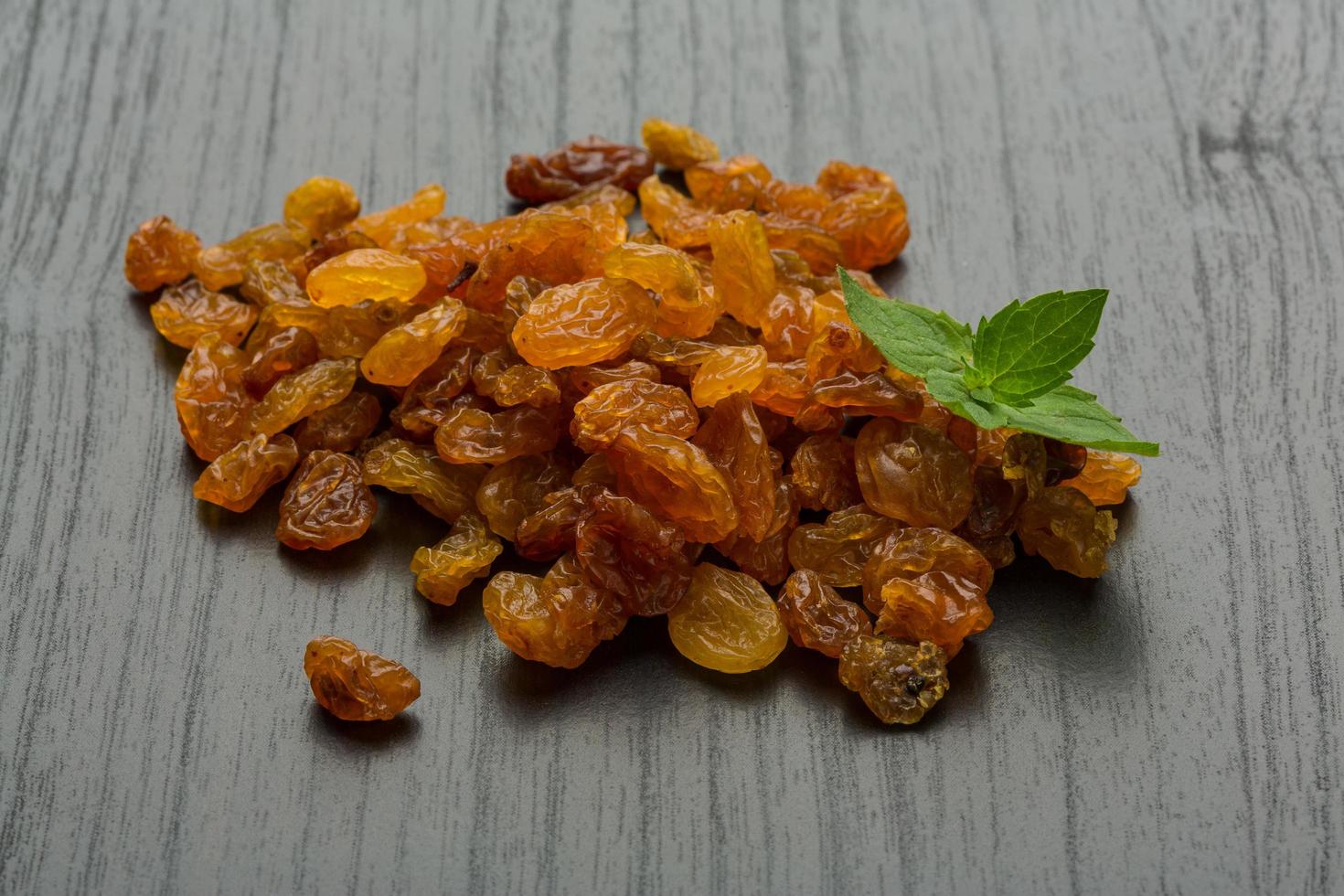 Raisin on wooden background photo