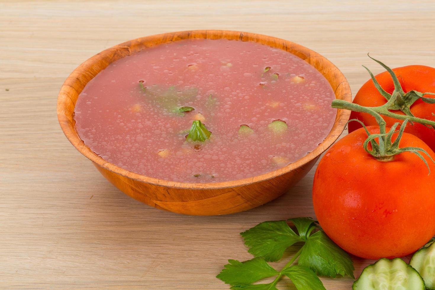 Gaspacho in a bowl on wooden background photo