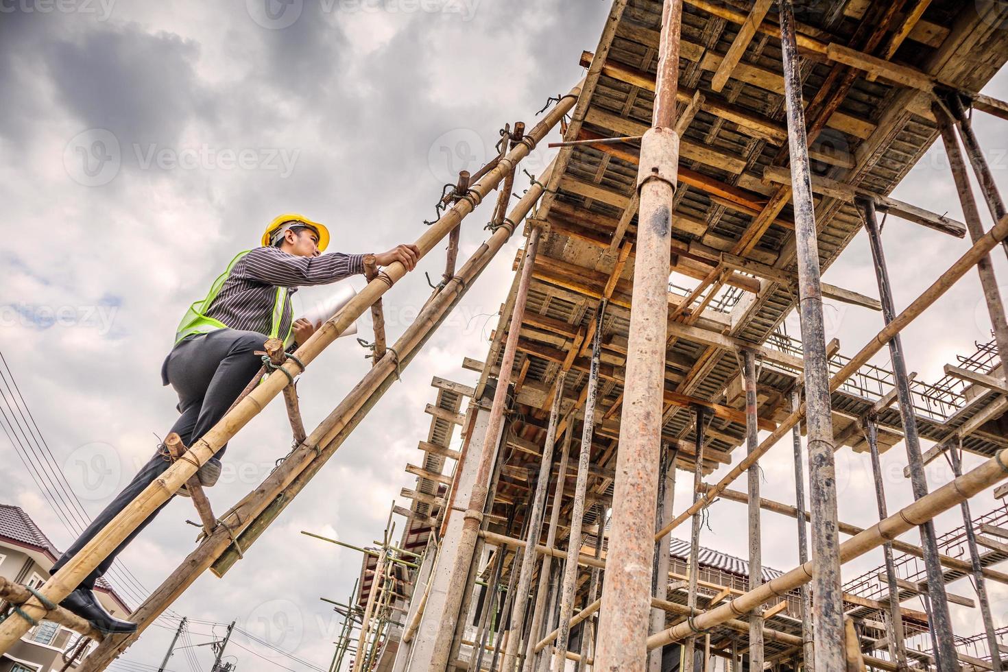professional engineer worker at the house building construction site photo
