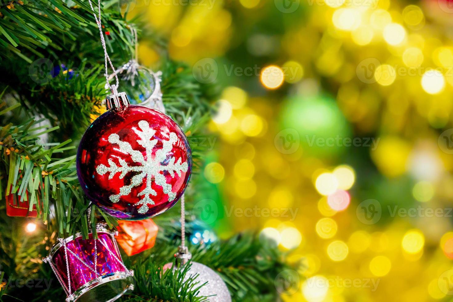 Decorated Christmas tree with abstract gold bokeh light background photo