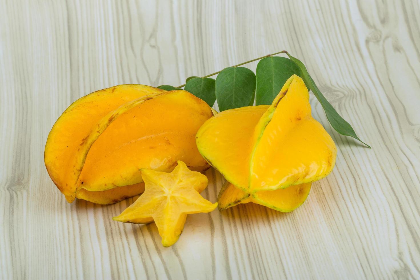 Carambola on wooden background photo