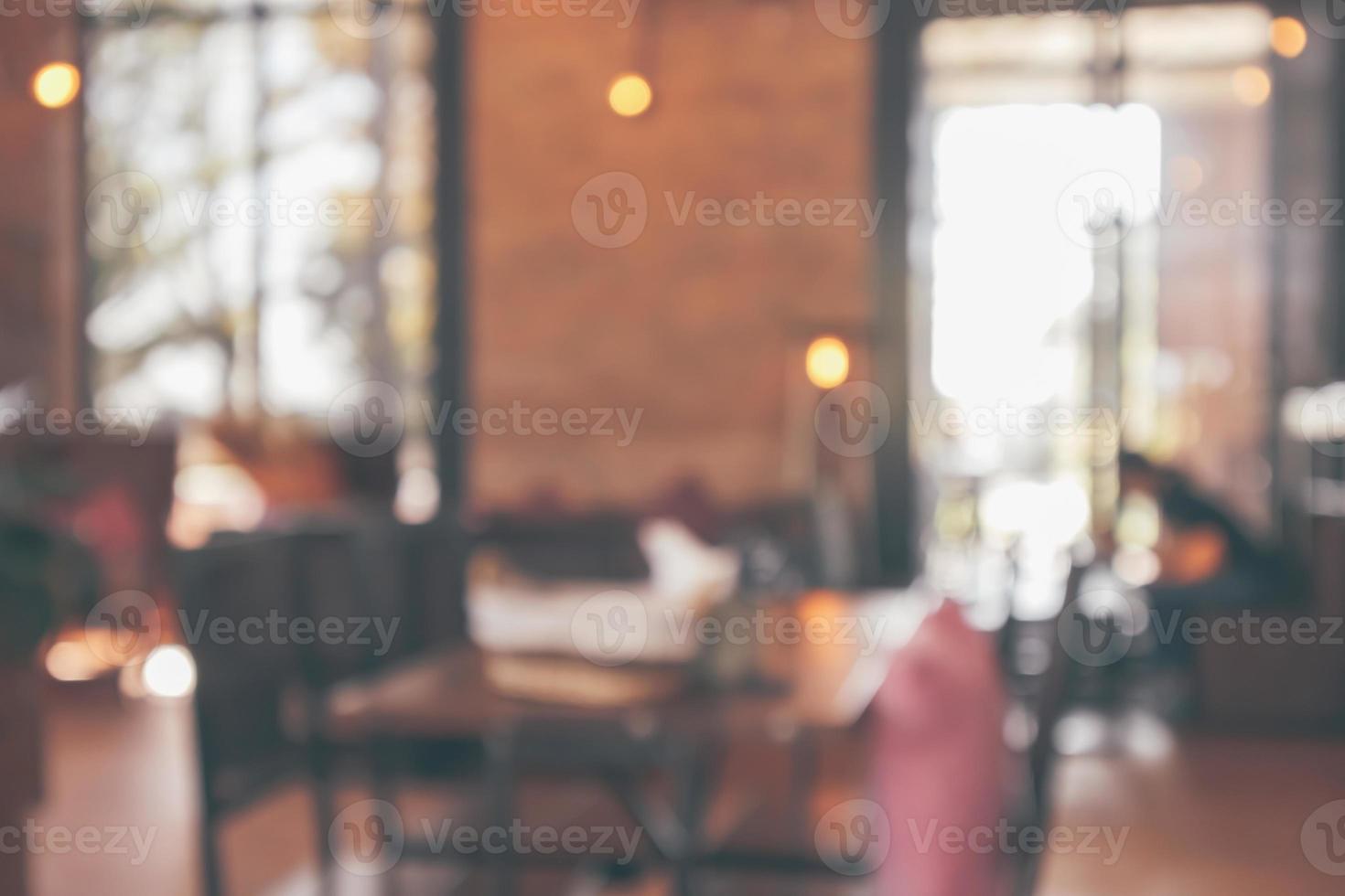 Restaurant cafe or coffee shop interior with customer blur abstract vintage style bokeh light for montage product display background photo