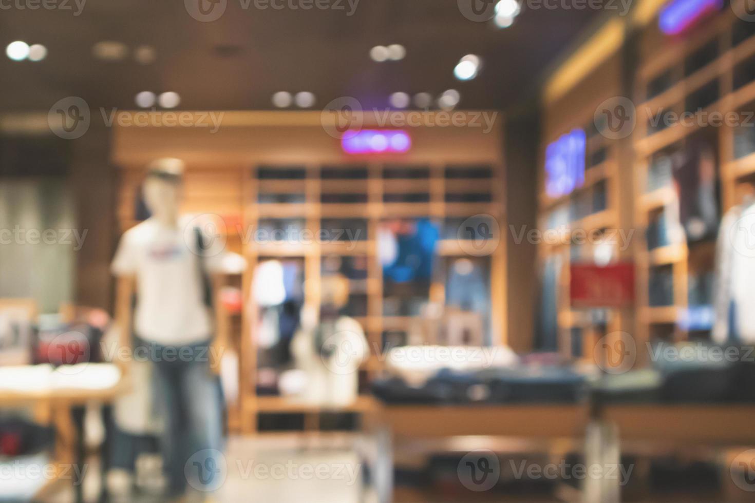 Abstract blur clothing store in modern shopping mall defocused background photo