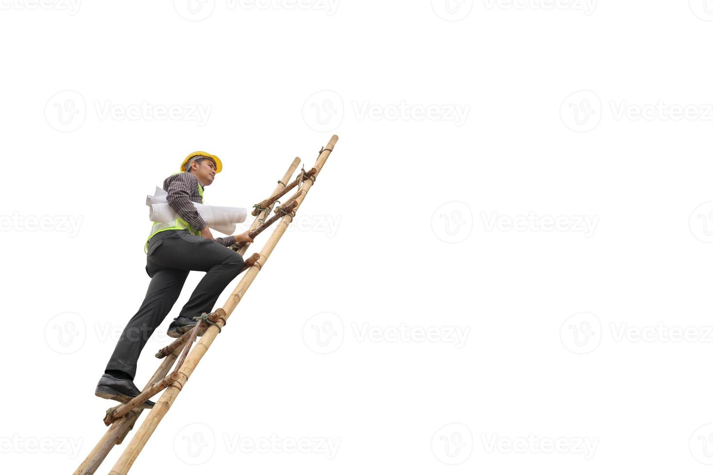 Asian business man construction engineer hold blueprint paper climb on ladder isolated on white background with clipping path photo