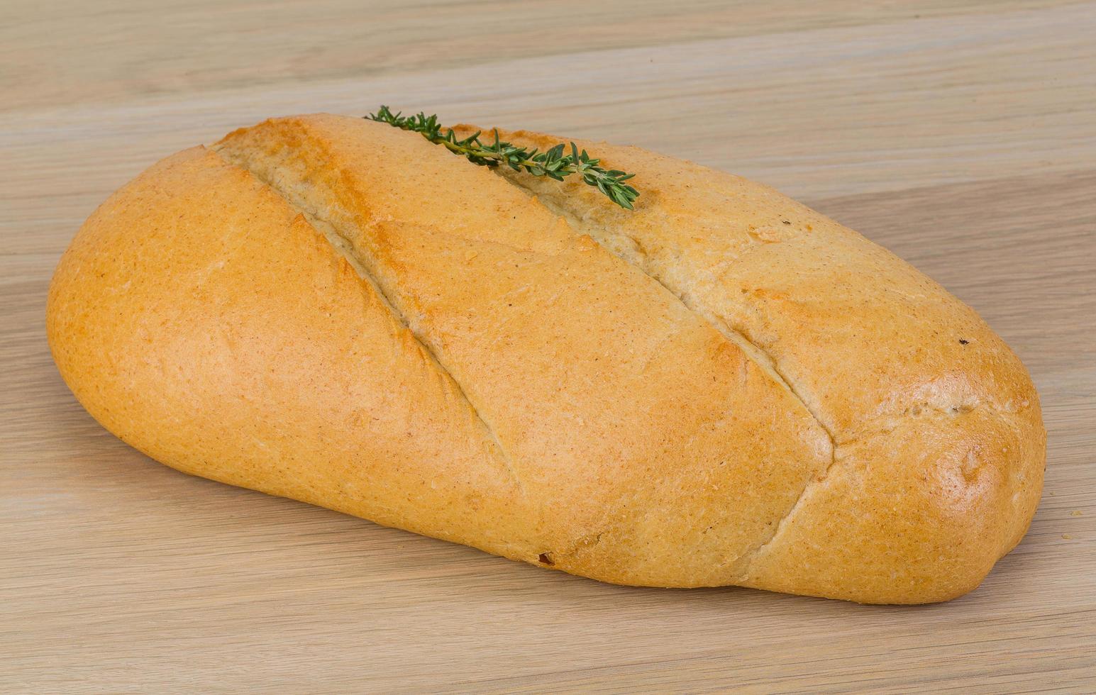 Baguette bread on wooden background photo