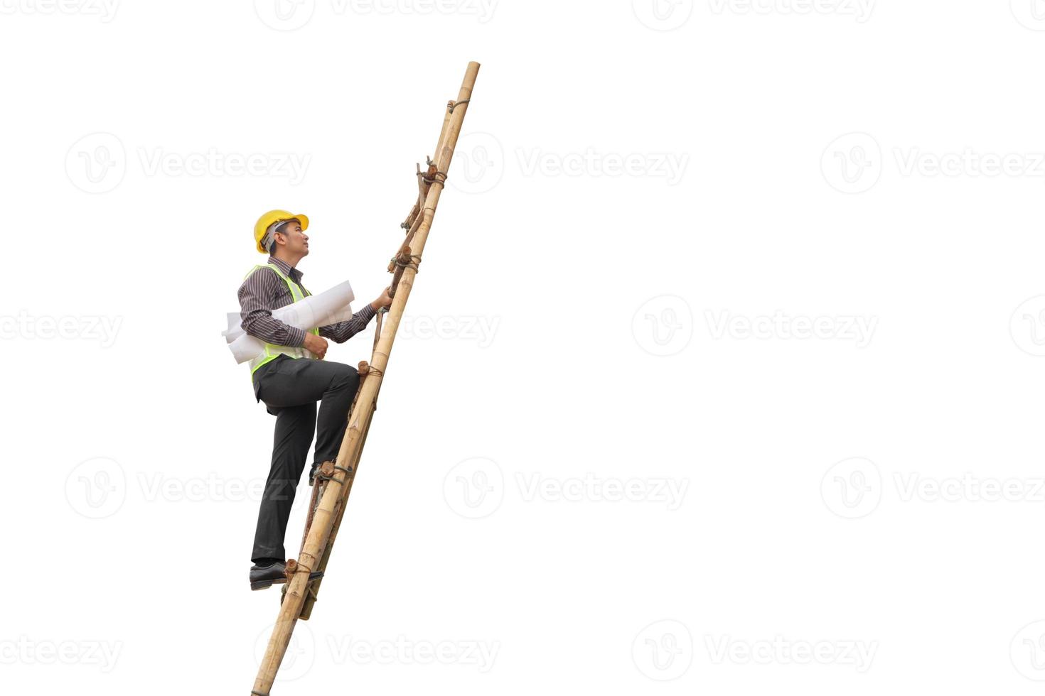 Asian business man construction engineer hold blueprint paper climb on ladder isolated on white background with clipping path photo