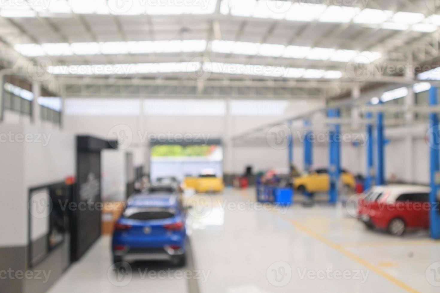 car service centre with auto at repair station bokeh light defocused blur background photo