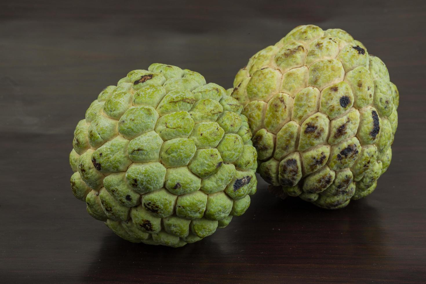 Custard apple on wooden background photo