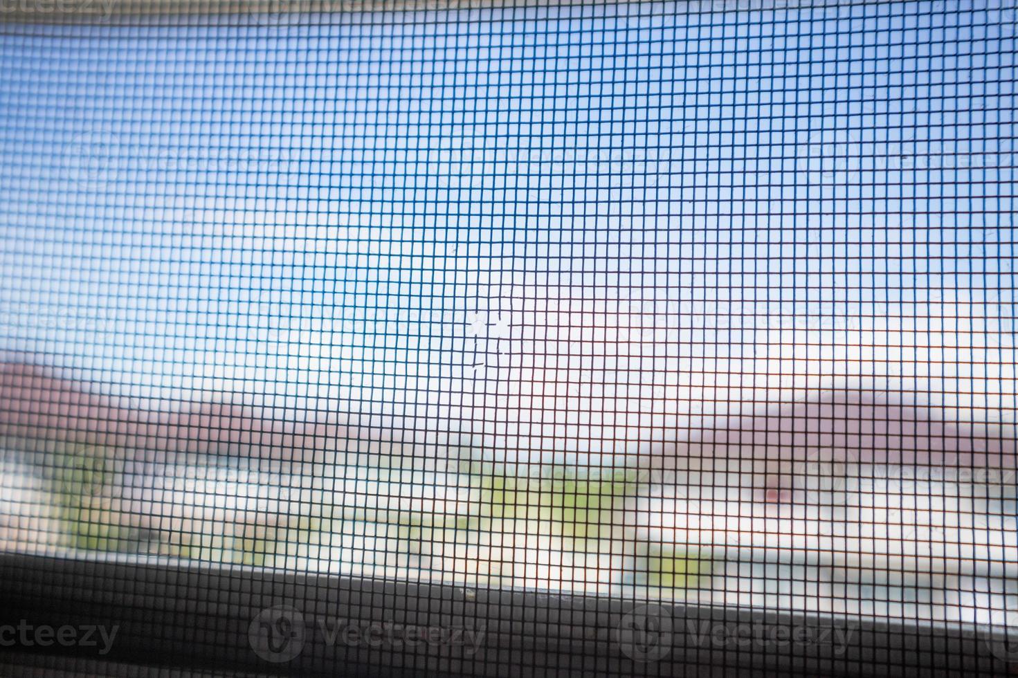 damaged mosquito net wire screen on house window protection against insect photo