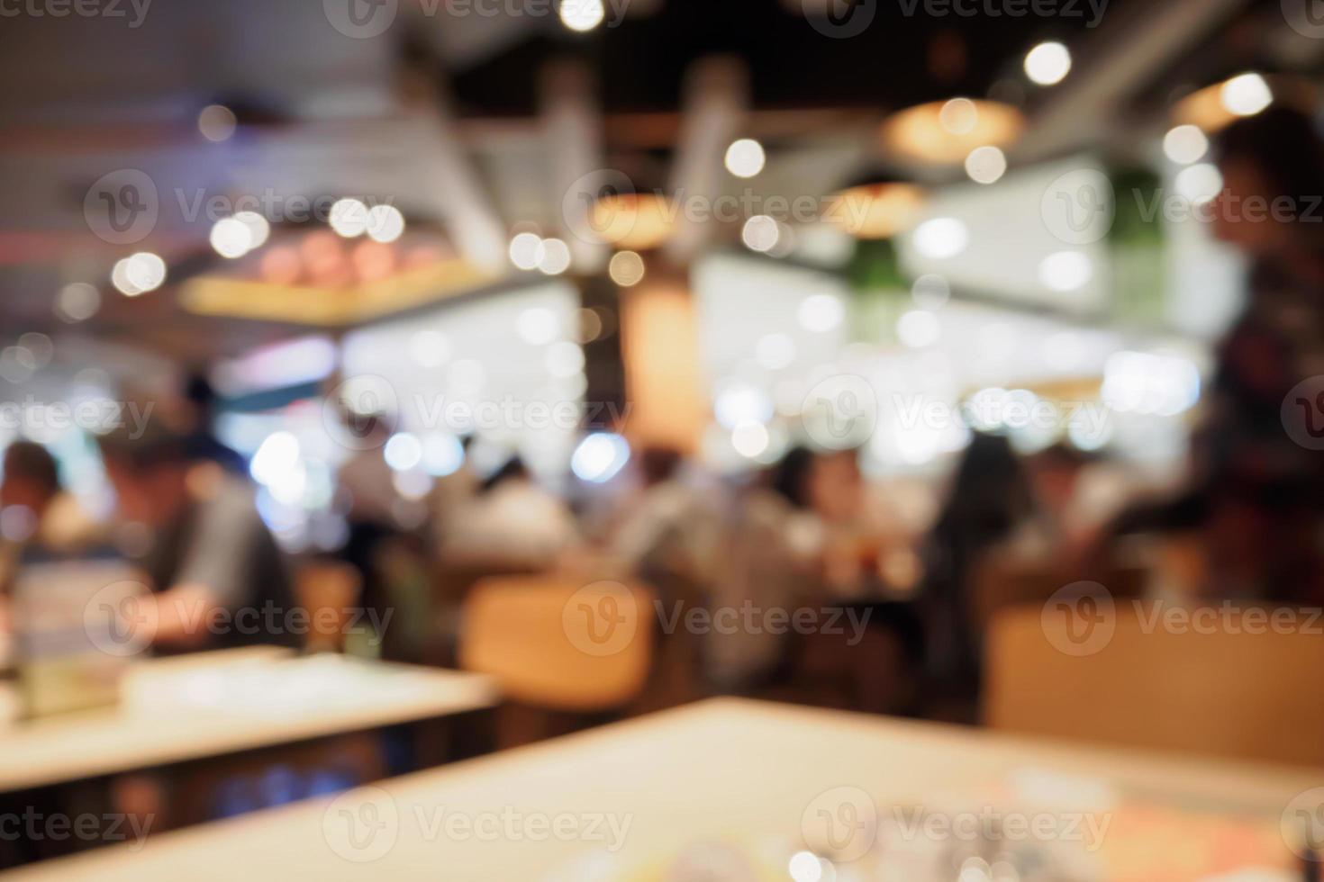 People in restaurant cafe interior with bokeh light blurred customer abstract background photo