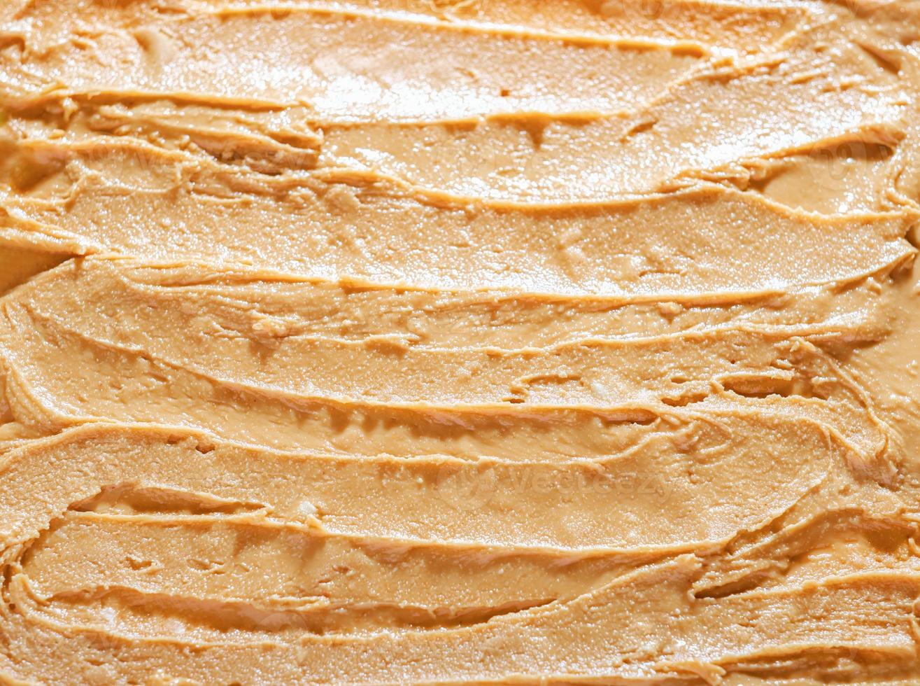 Peanut butter texture. Spread swirl. Organic keto food. Healthy creamy paste. Smooth closeup brown snack. Fat breakfast photo