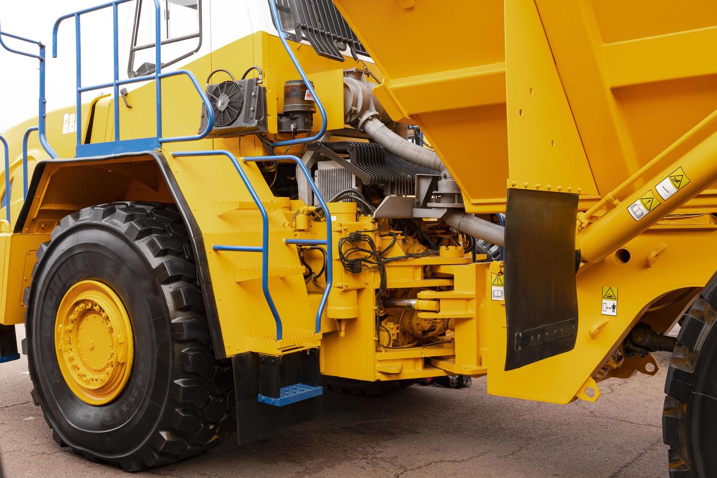 Minsk, Belarus, September 20, 2022- Yellow mining dump truck Belaz with a carrying capacity of twenty tons. photo