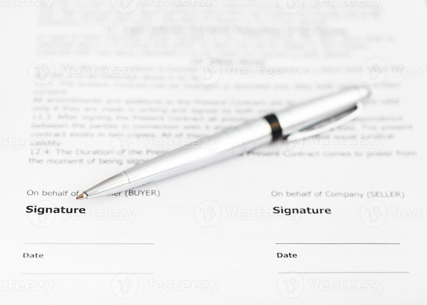 silver pen on signature page of contract photo