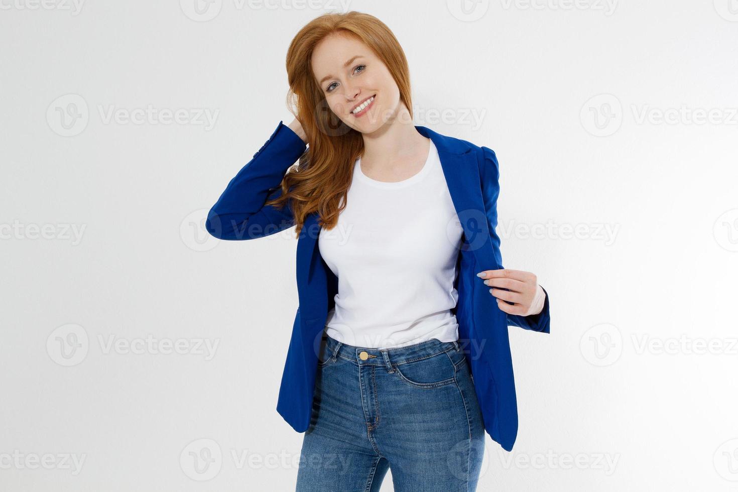 Woman in white t shirt and black leather jacket isolated on white background. Red hair girl in fashion clothes front view. Blank template summer t-shirt. Copy space photo