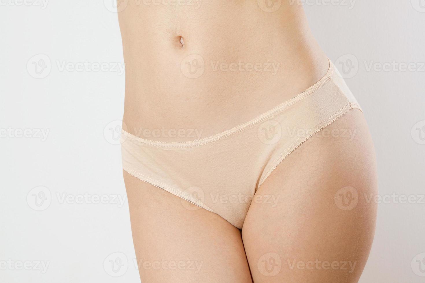 Woman blank template Panties flesh colored closeup with copy space and mock up isolated. Front view. Female beauty and health. Body hair removal and shaving line concept. Summer beauty care. photo