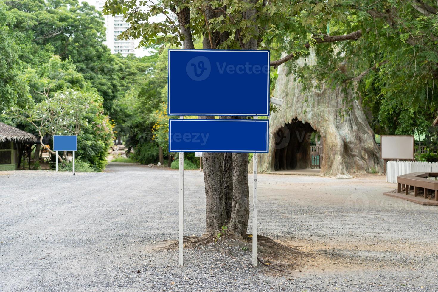 Blue traffic sign in paking lots with tree around. Clipping Paths photo