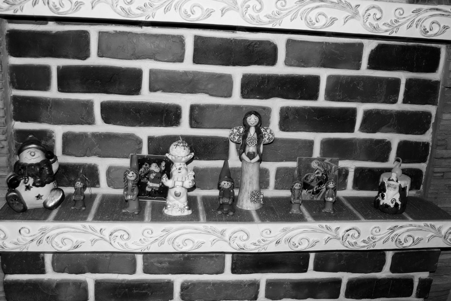 Christmas figurines made of recyclable materials and carving paste in black version photo